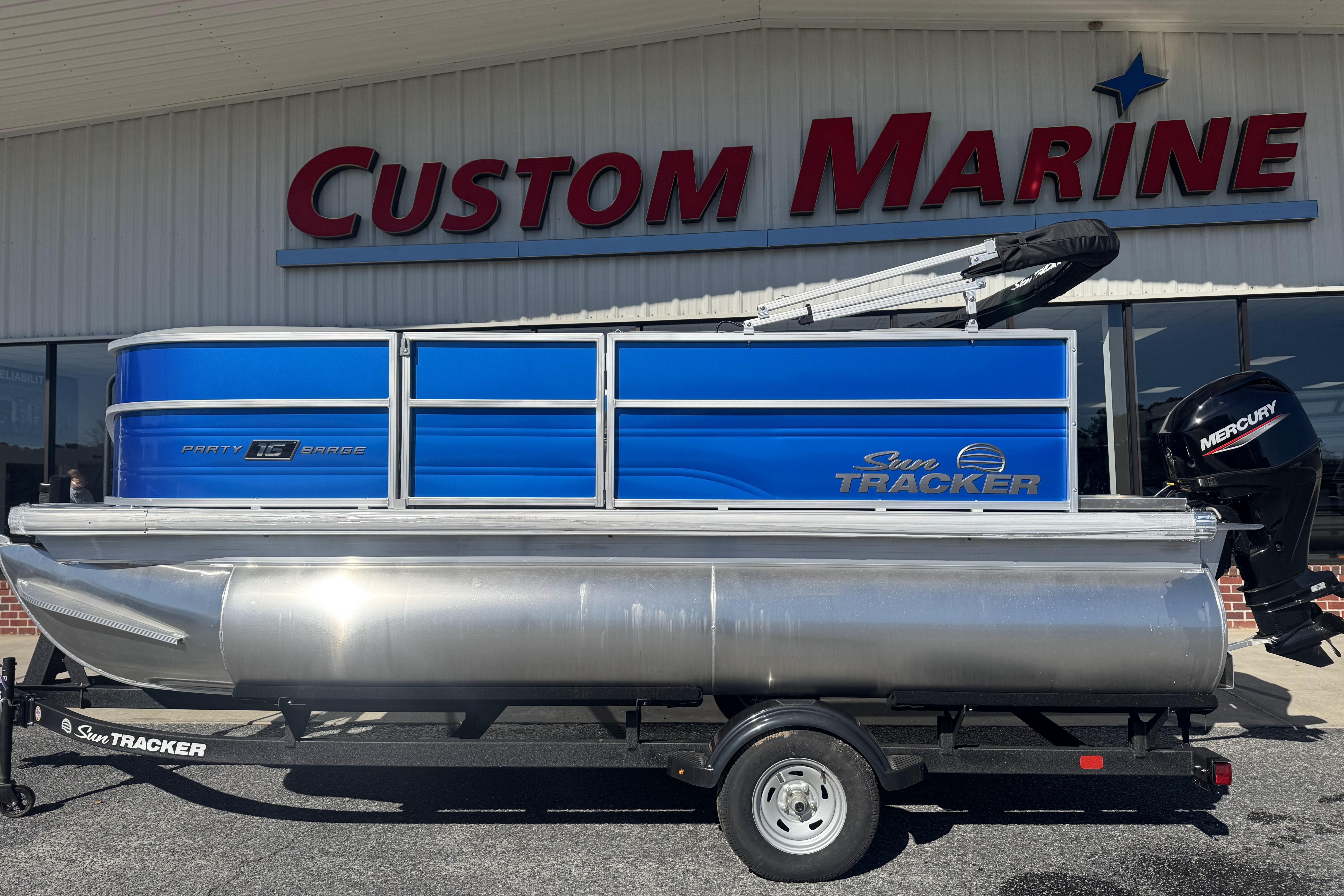 2026 Sun Tracker Party Barge 16 DLX pontoon boat at Custom Marine dealership.