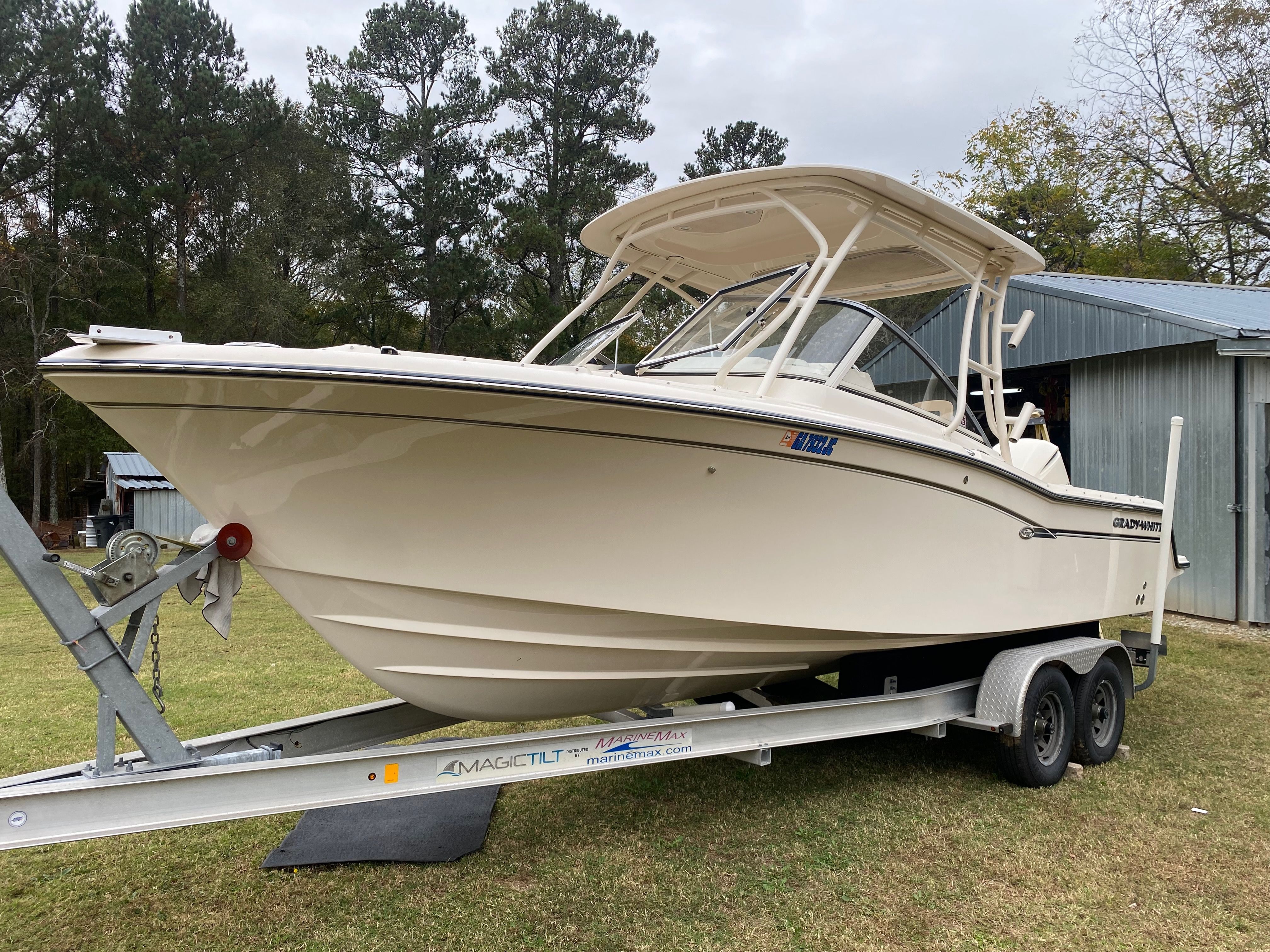 2018 Grady-White Freedom 235 boat on trailer outdoors.