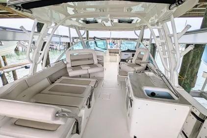 2017 Boston Whaler 320 Vantage boat interior with seating and helm station.