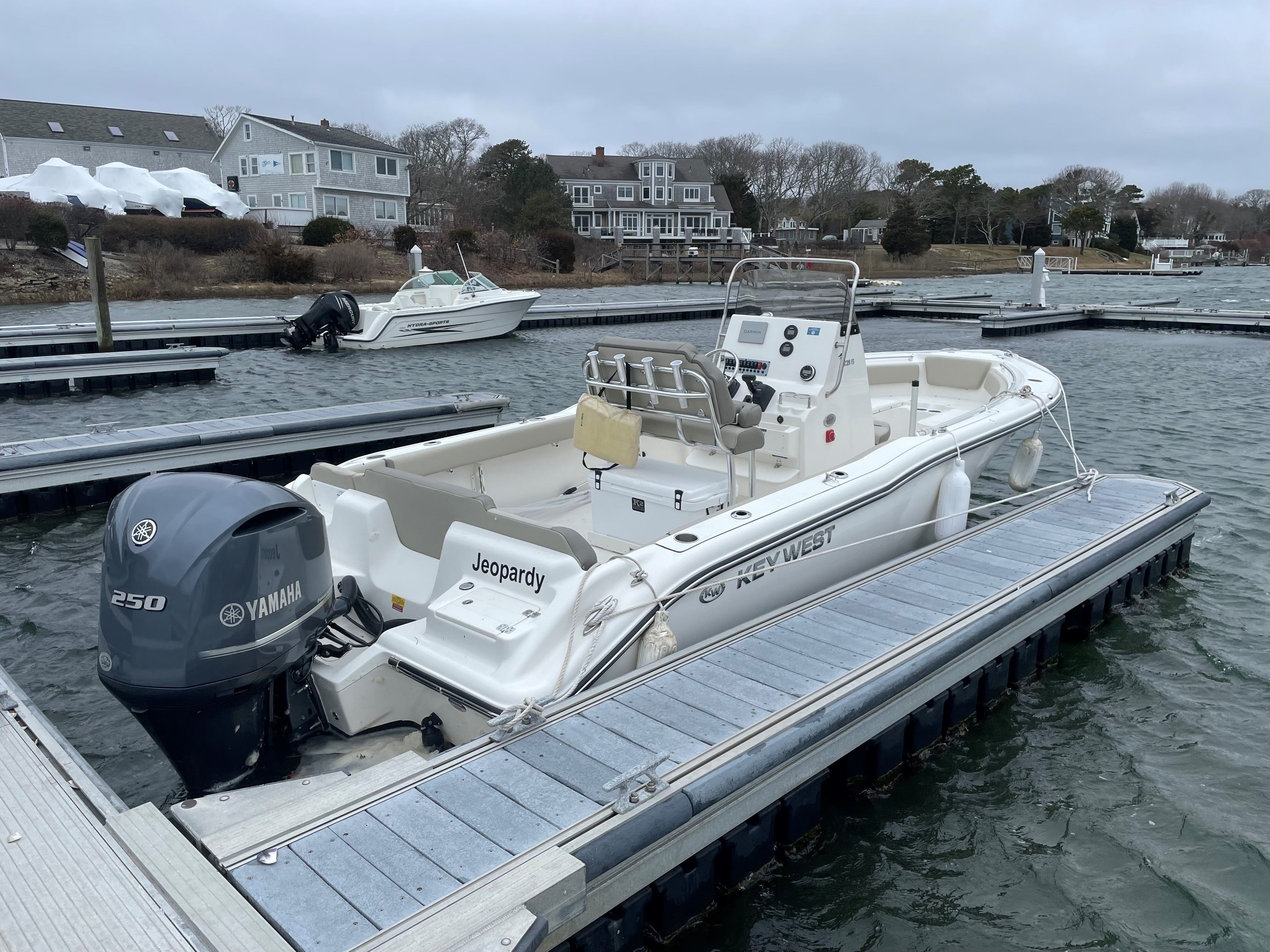 2024 Key West 239 FS boat docked with Yamaha engine.