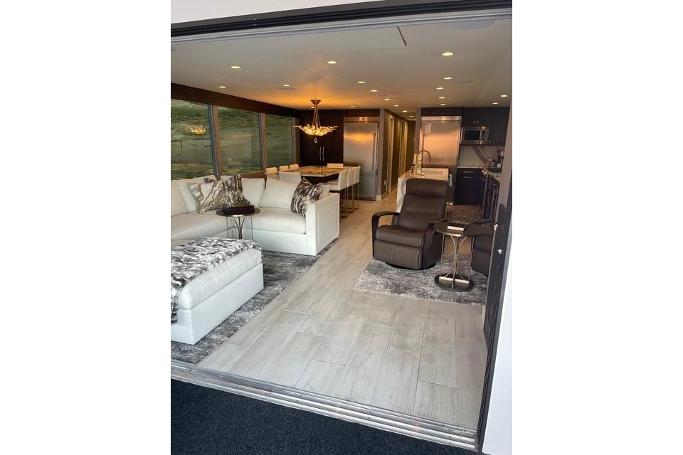 Luxurious interior of Adonia's 2021 "The Queen Elizabeth" with modern furnishings and elegant decor.