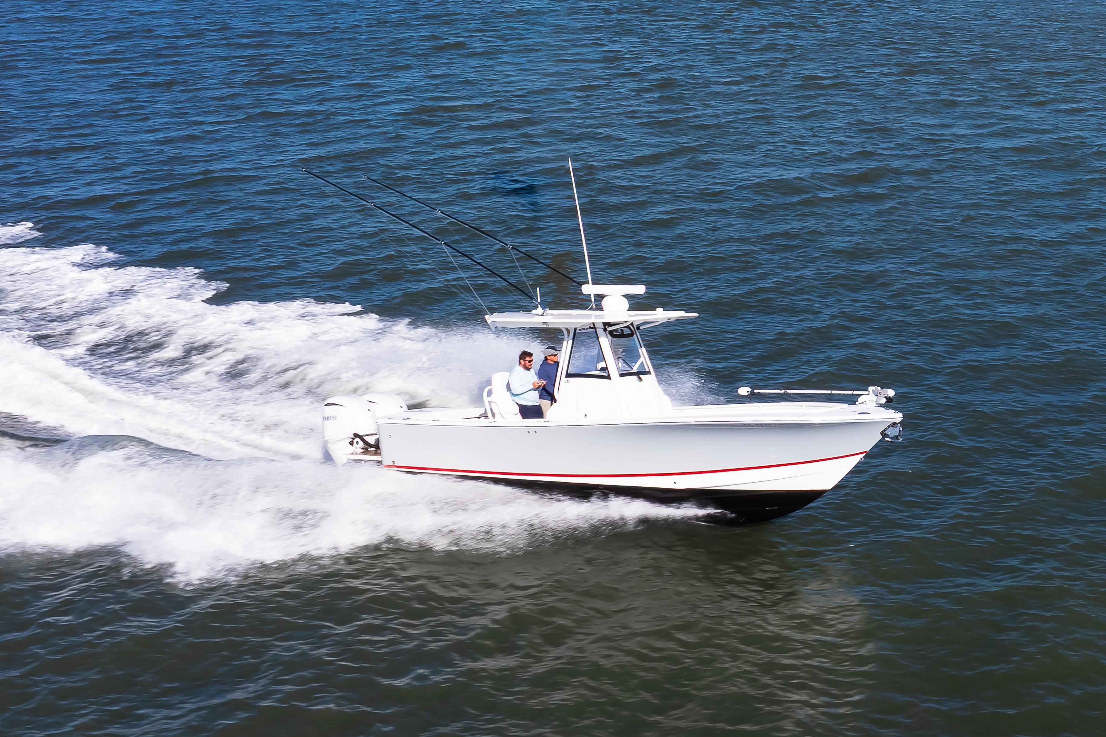 2022 Regulator 28 Forward Seating boat cruising on open water.