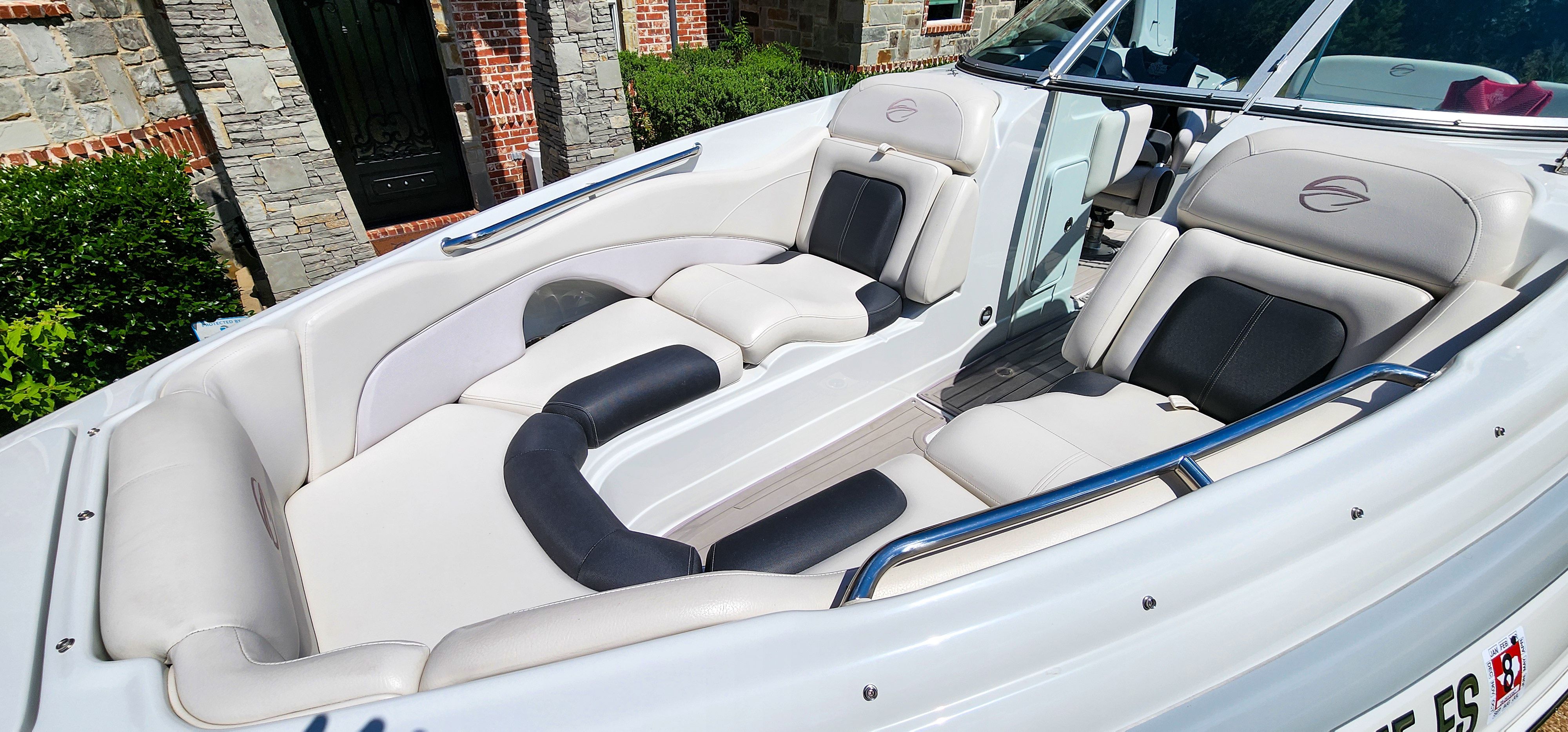 The image shows the cockpit of a 2017 Crownline 285SS boat with luxurious seating.