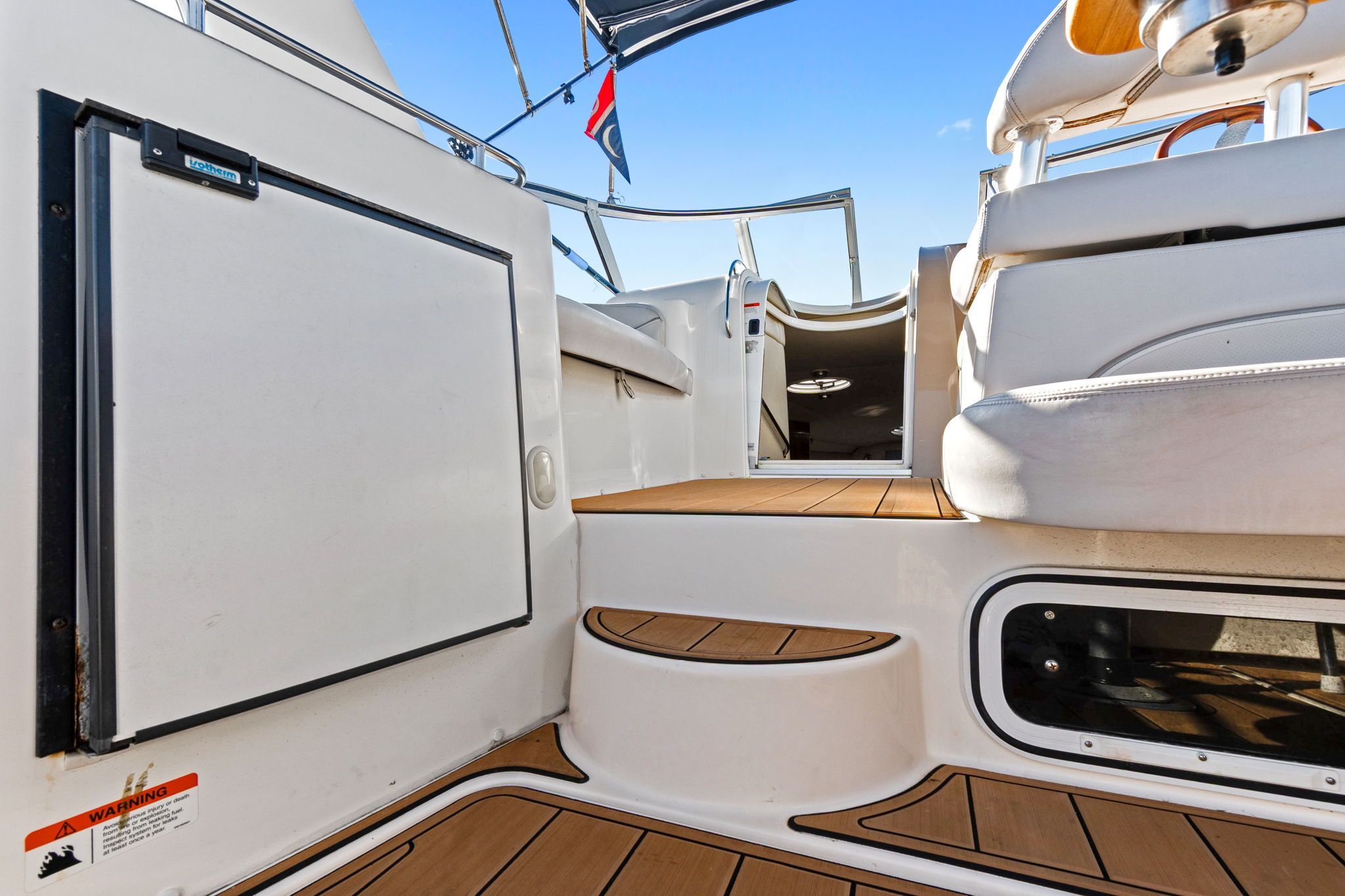 2007 Larson Cabrio 330 with teak flooring and comfortable seating arrangement.