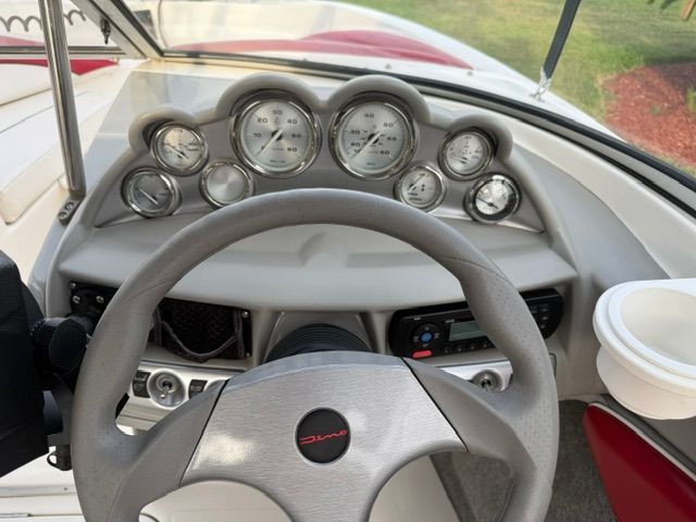 Dashboard of a 2012 Bayliner 184 SF boat with instruments.