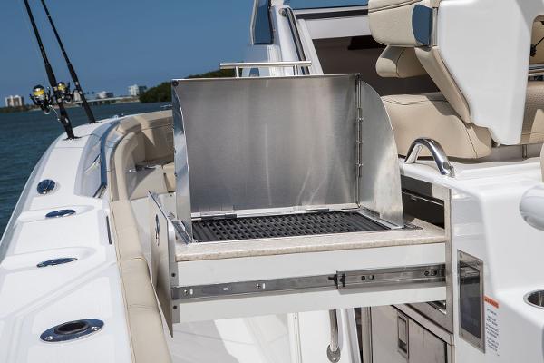 Manufacturer Provided Image: 2018 Pursuit S 368 Sport boat with built-in grill and fishing rod holders.