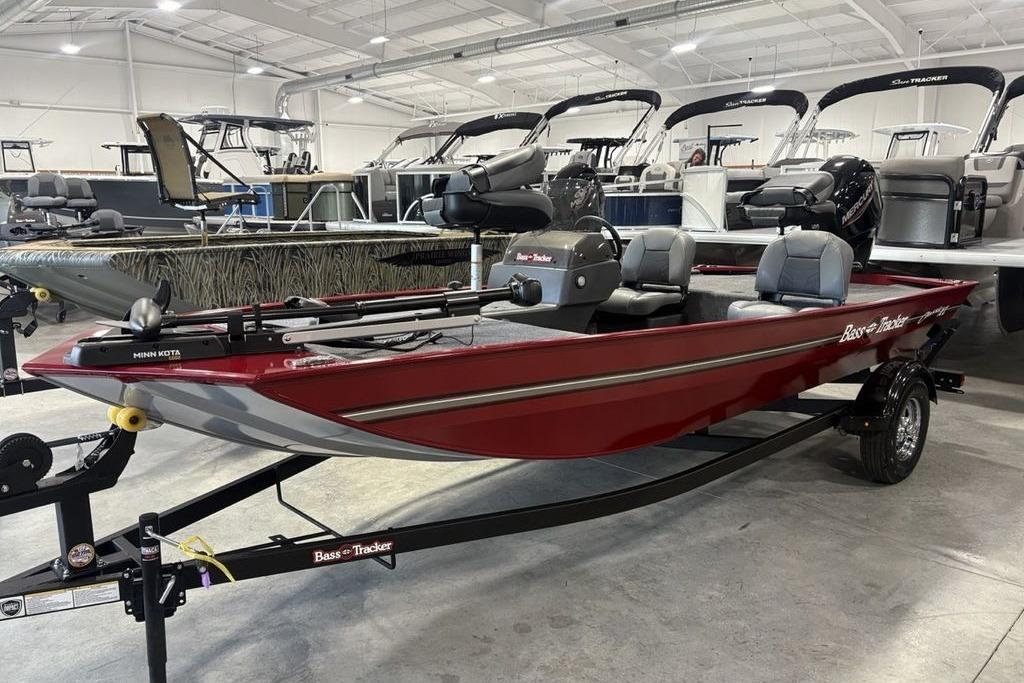 2026 Tracker Bass Tracker Classic XL boat in showroom, red exterior, on trailer.