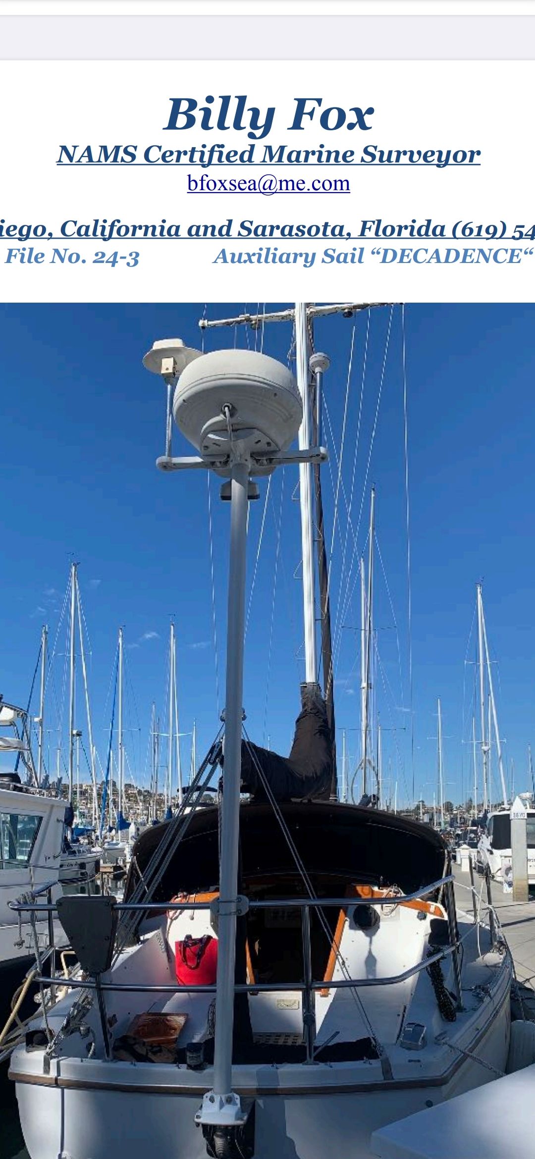 A 1977 Catalina 30 sailboat docked in a marina. The mast is prominently upright.