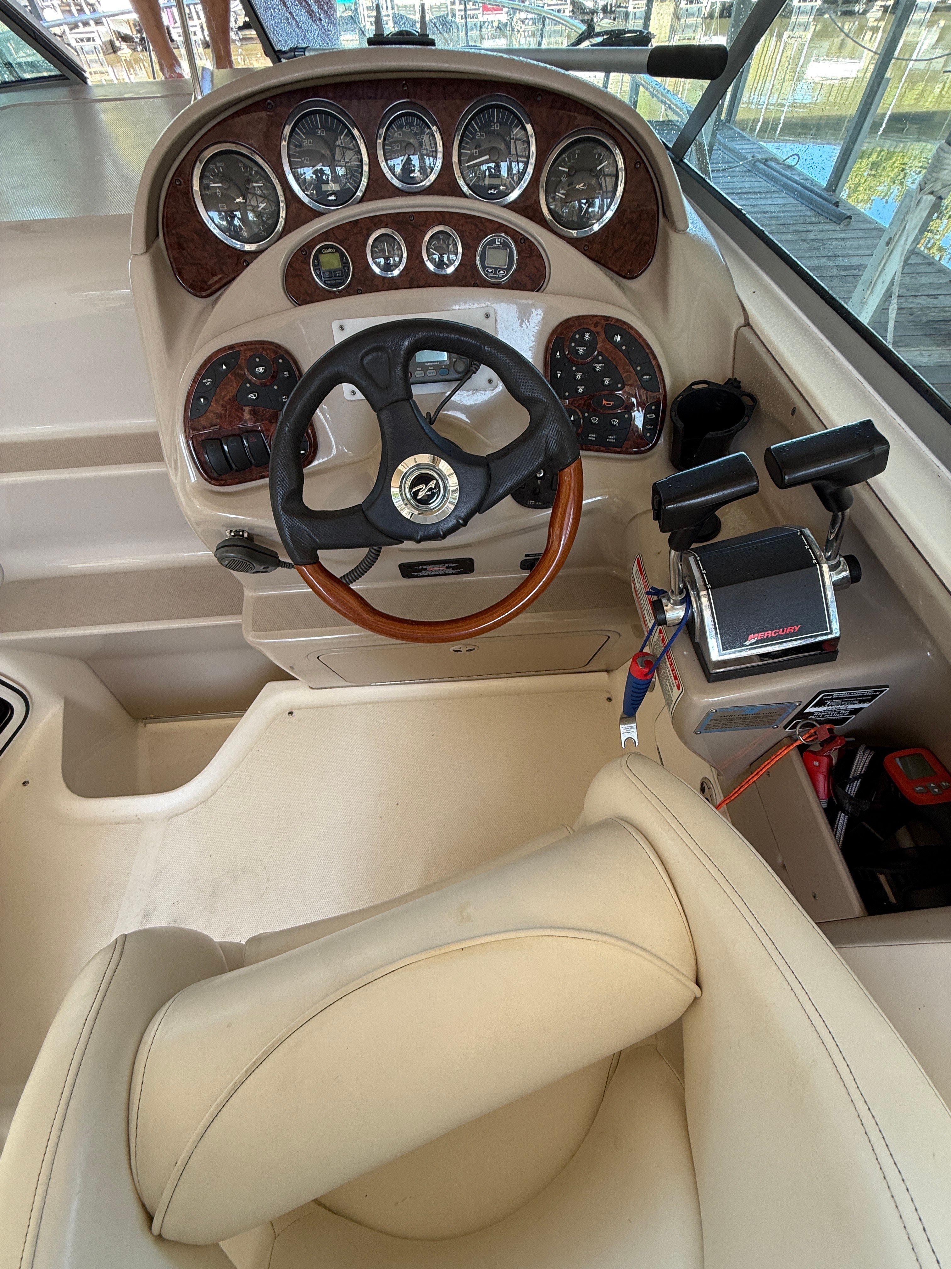 Helm of a 2003 Sea Ray Sundancer 280 with instruments.