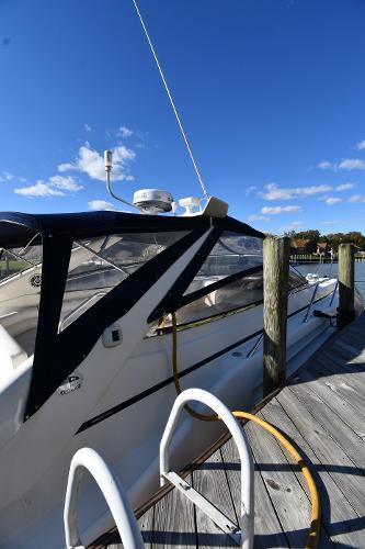 1997 Sunseeker Camargue 47 yacht docked under clear blue sky.