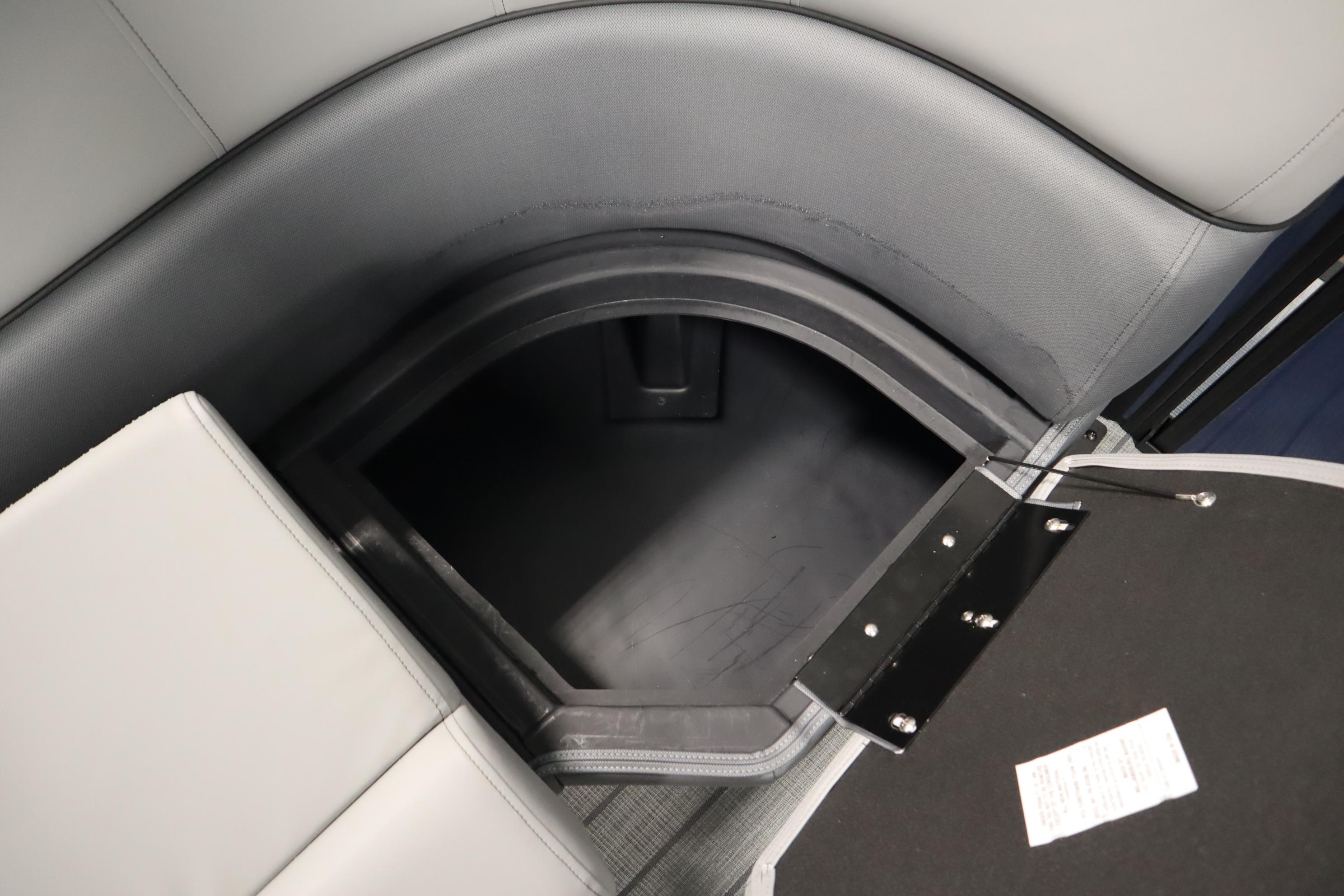 2025 Bentley Pontoons Elite 253 Admiral Tri-toon storage compartment with open seat.