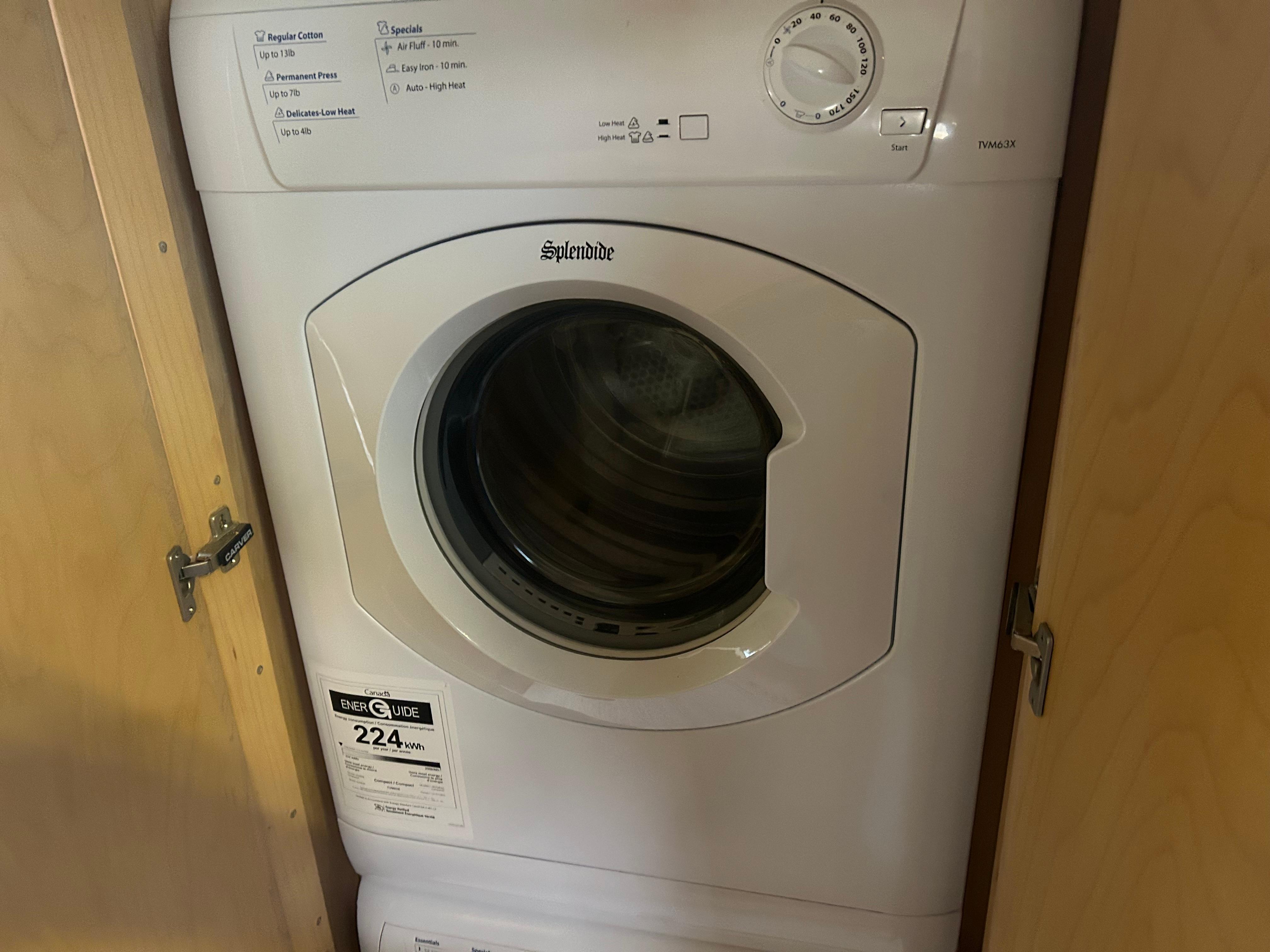 Front-loading washer inside Carver 440 Aft Cabin Motor Yacht, 1996 model.