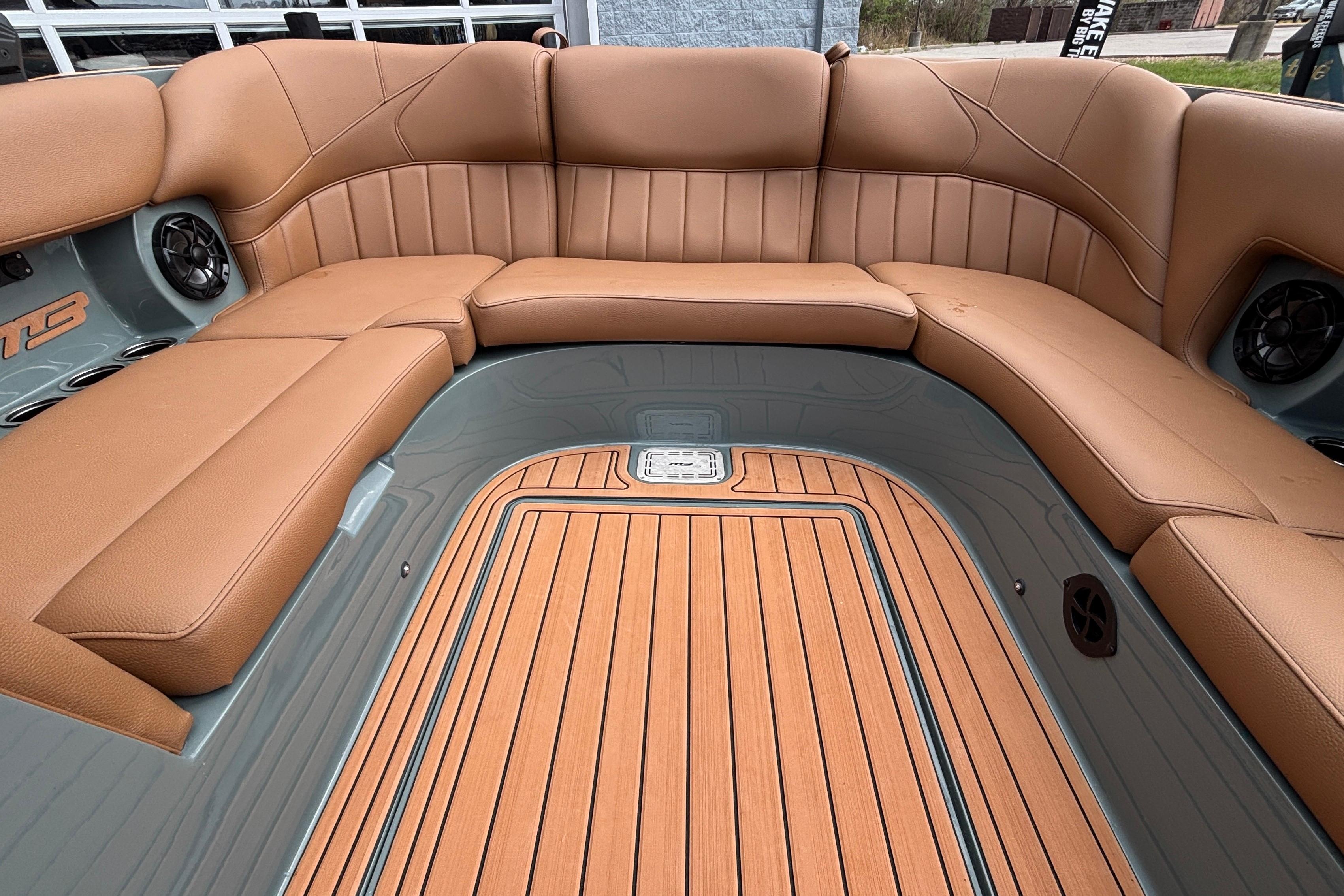 Luxurious interior of 2026 MB B52 23 Classic boat with tan leather seating.