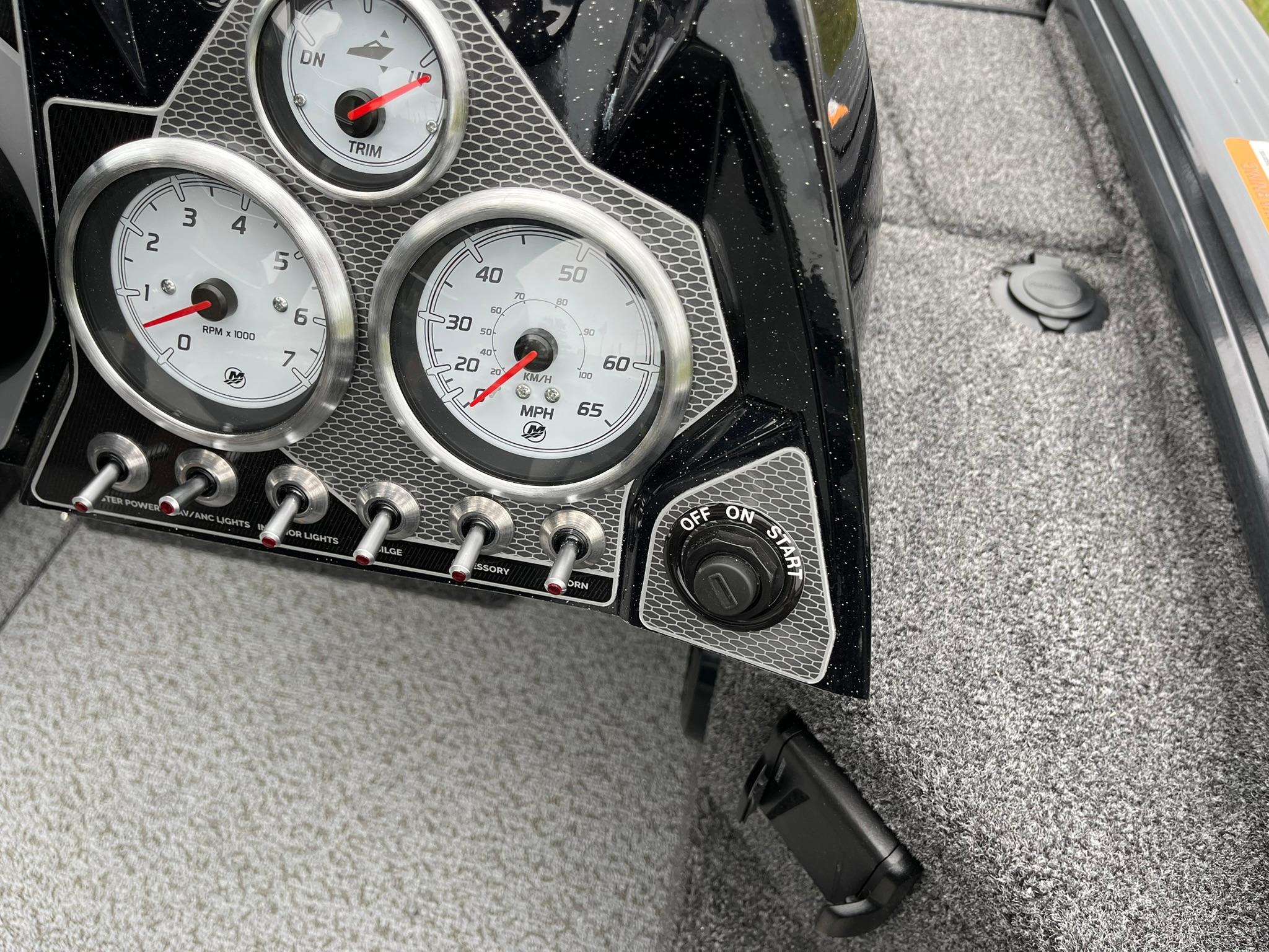Dashboard of 2026 Lund 1875 Pro-V Bass XS with gauges and switches.