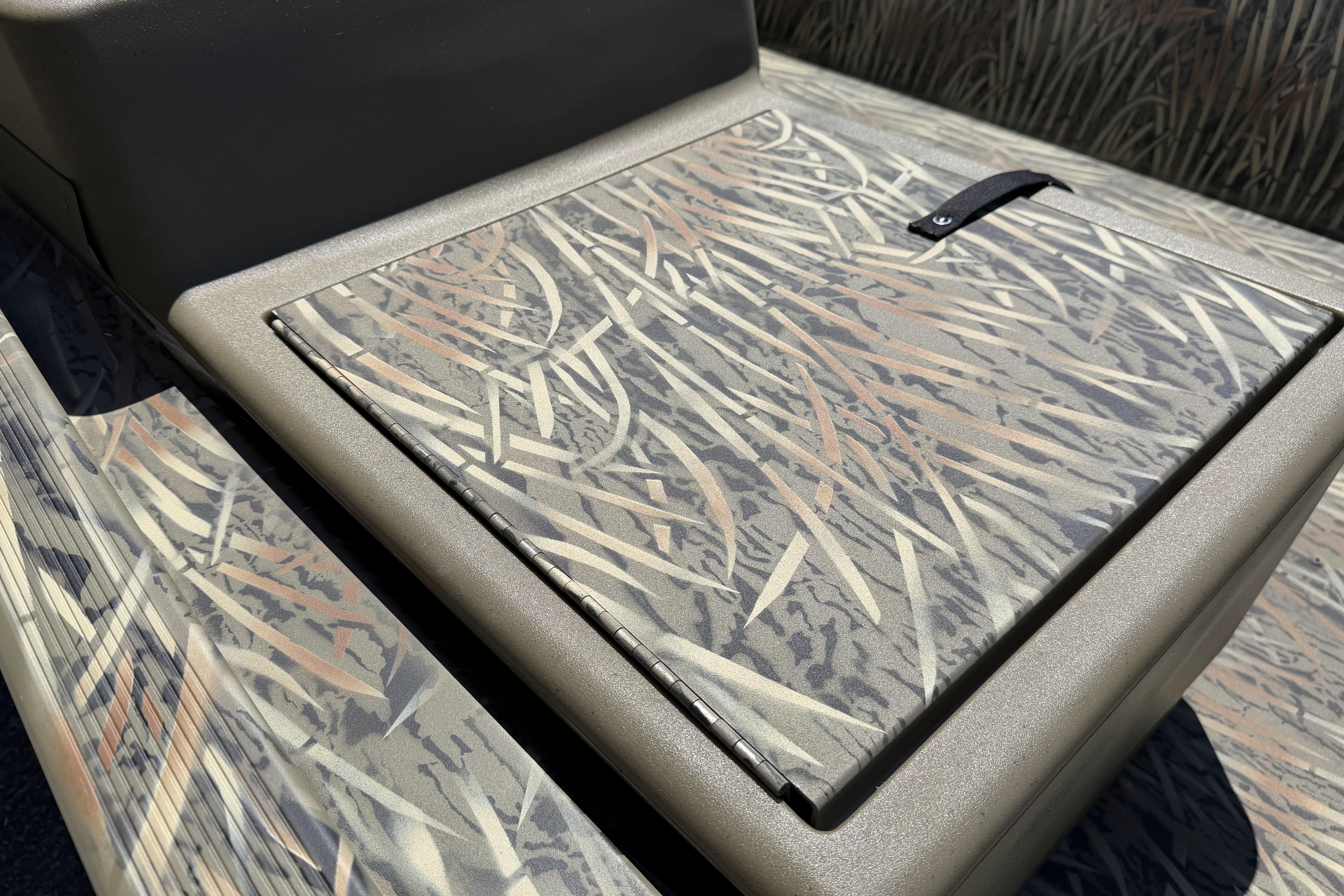 2026 Tracker Grizzly 1648 SC boat with camouflage pattern detail.