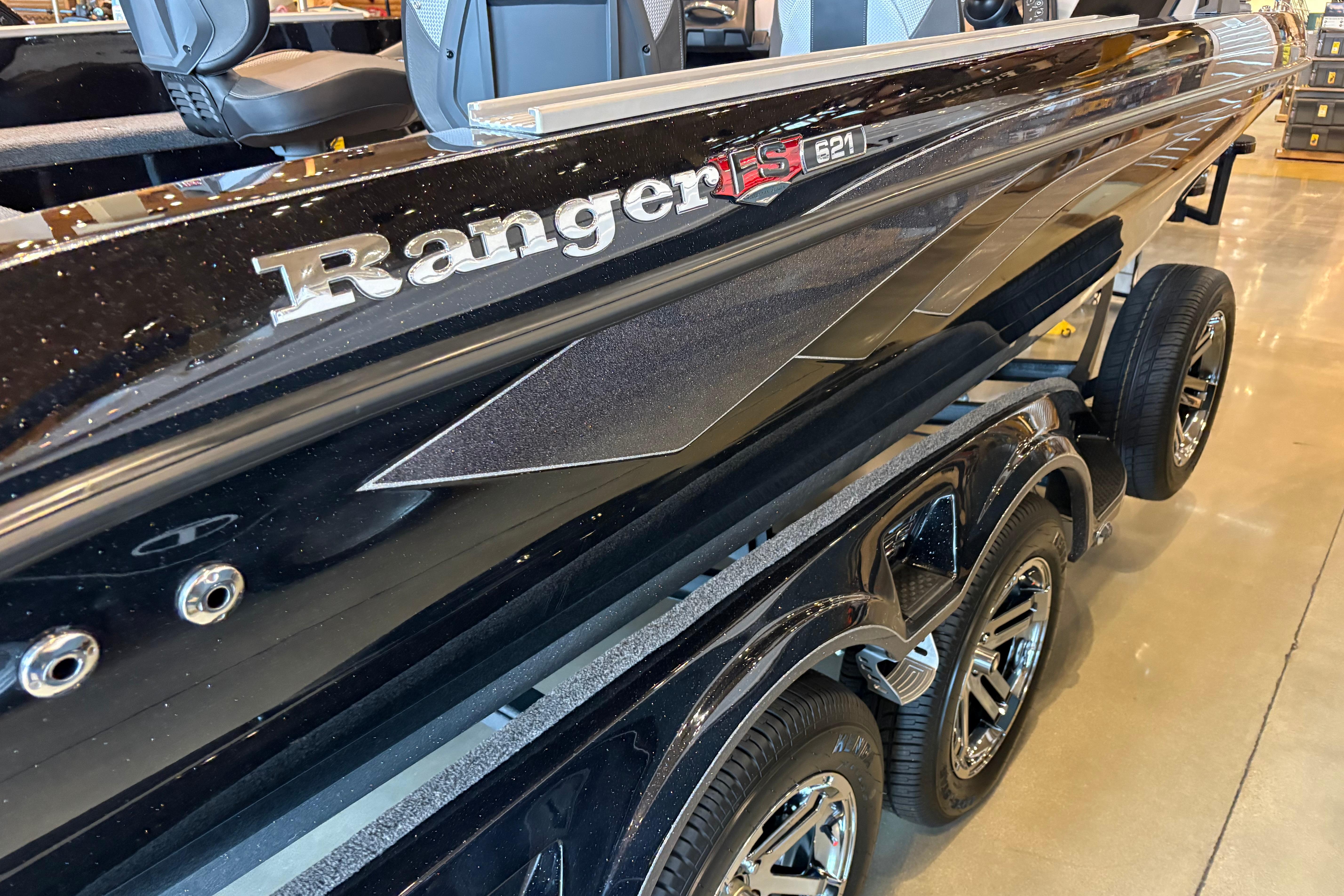 2026 Ranger 621FS Cup-Equipped boat, sleek black design, displayed indoors.