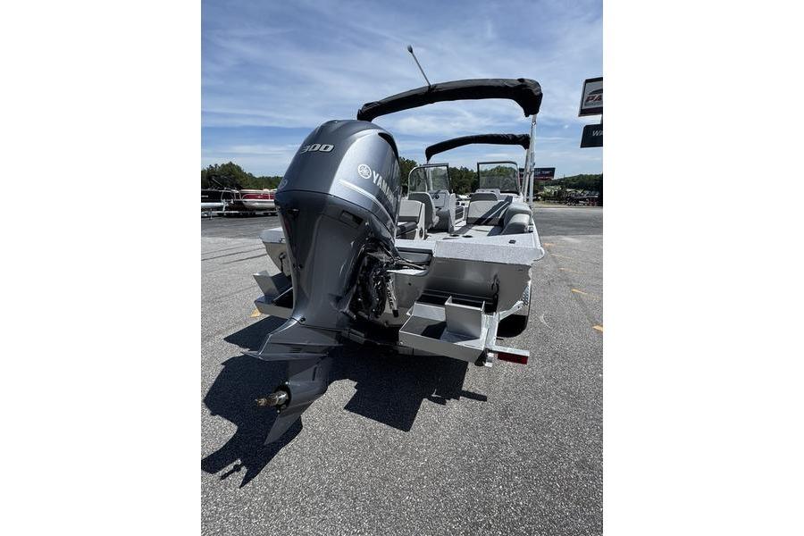 2025 SeaArk Super Lounge Easy boat with Yamaha engine, parked outdoors.