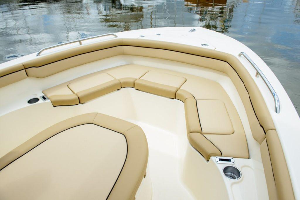 Manufacturer Provided Image: 2025 Scout 215 XSF boat interior with beige seating and cup holders.