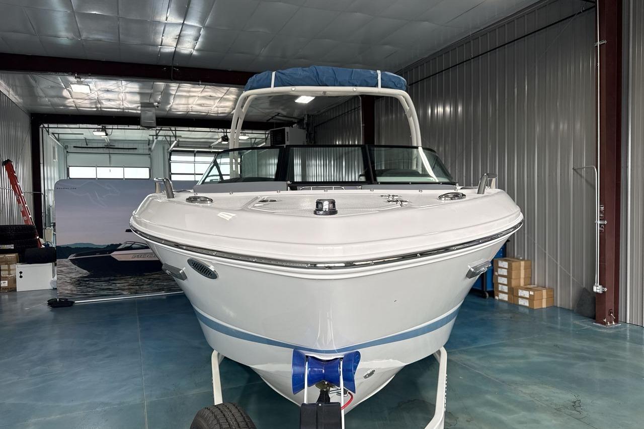 2026 Chaparral SSX 4 in a warehouse, featuring a blue cover on the roof.