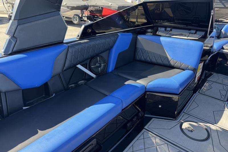 Interior of 2022 Tigé Z3 boat with blue and black seating.