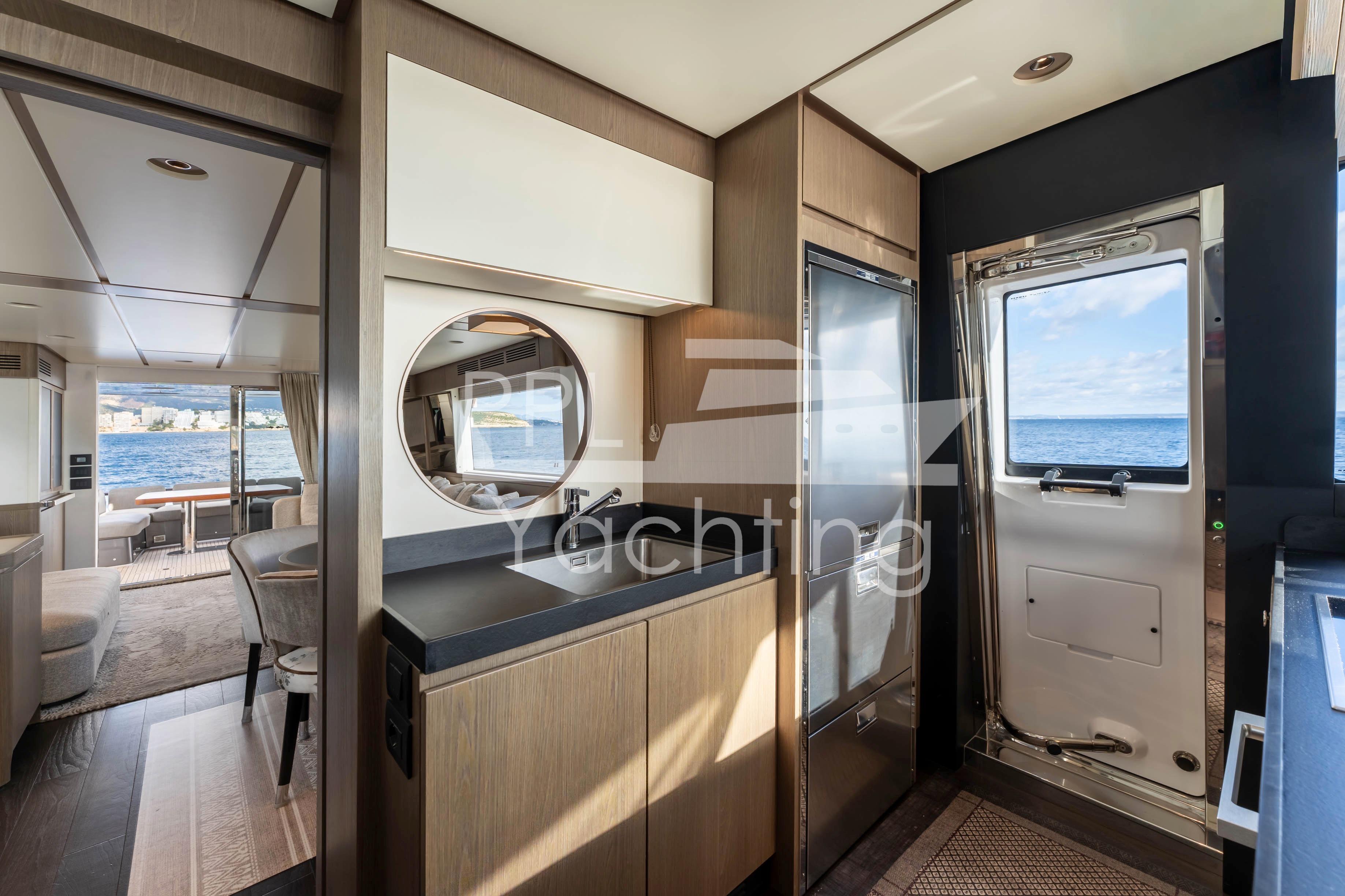 Luxurious interior of 2021 Azimut Magellano 66 yacht with ocean view.
