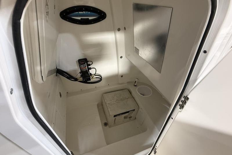 Interior of 2026 Sea Pro 242 Center Console boat storage compartment.