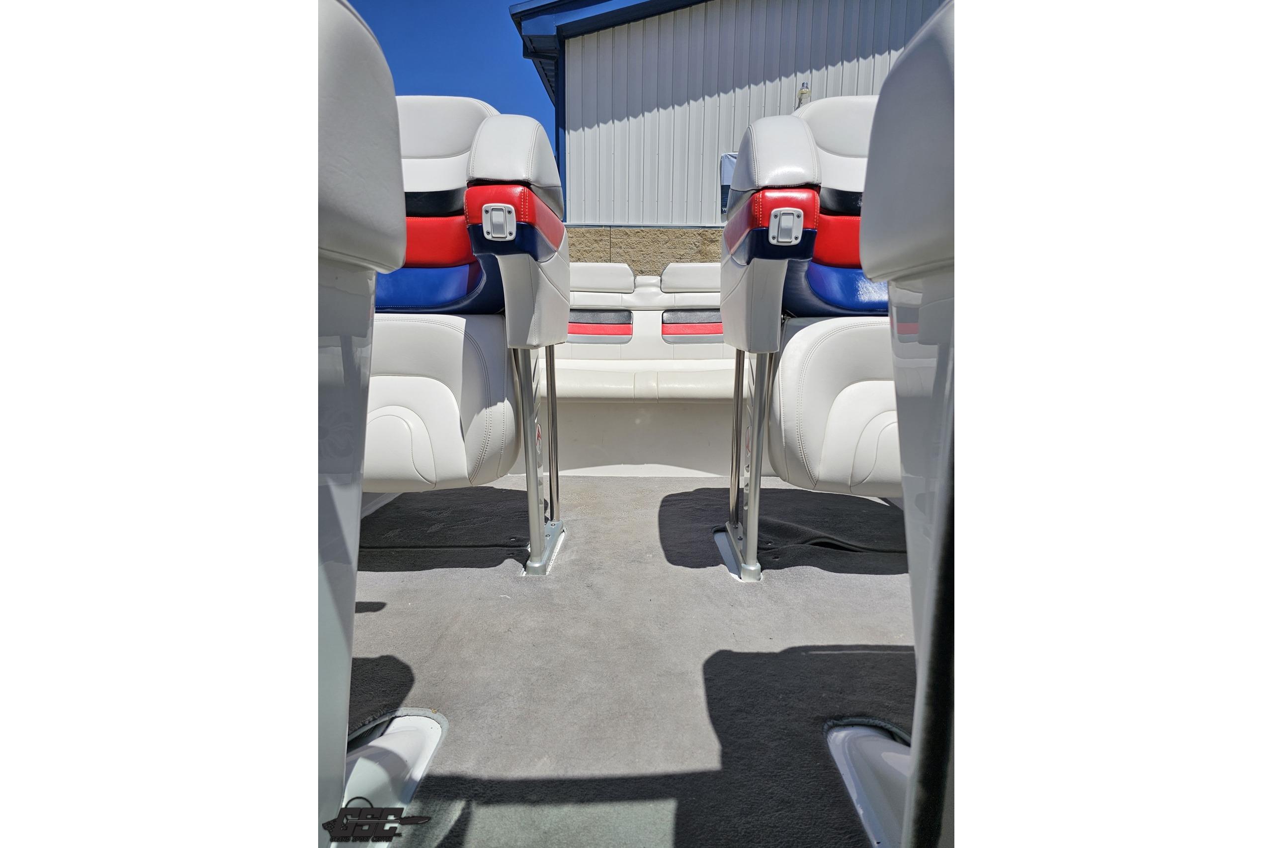Interior view of 2005 Formula 271 FASTech boat with white and red seating.