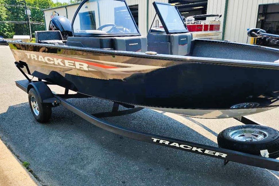 2026 Tracker Pro Guide V-175 Combo boat on trailer, parked outdoors.
