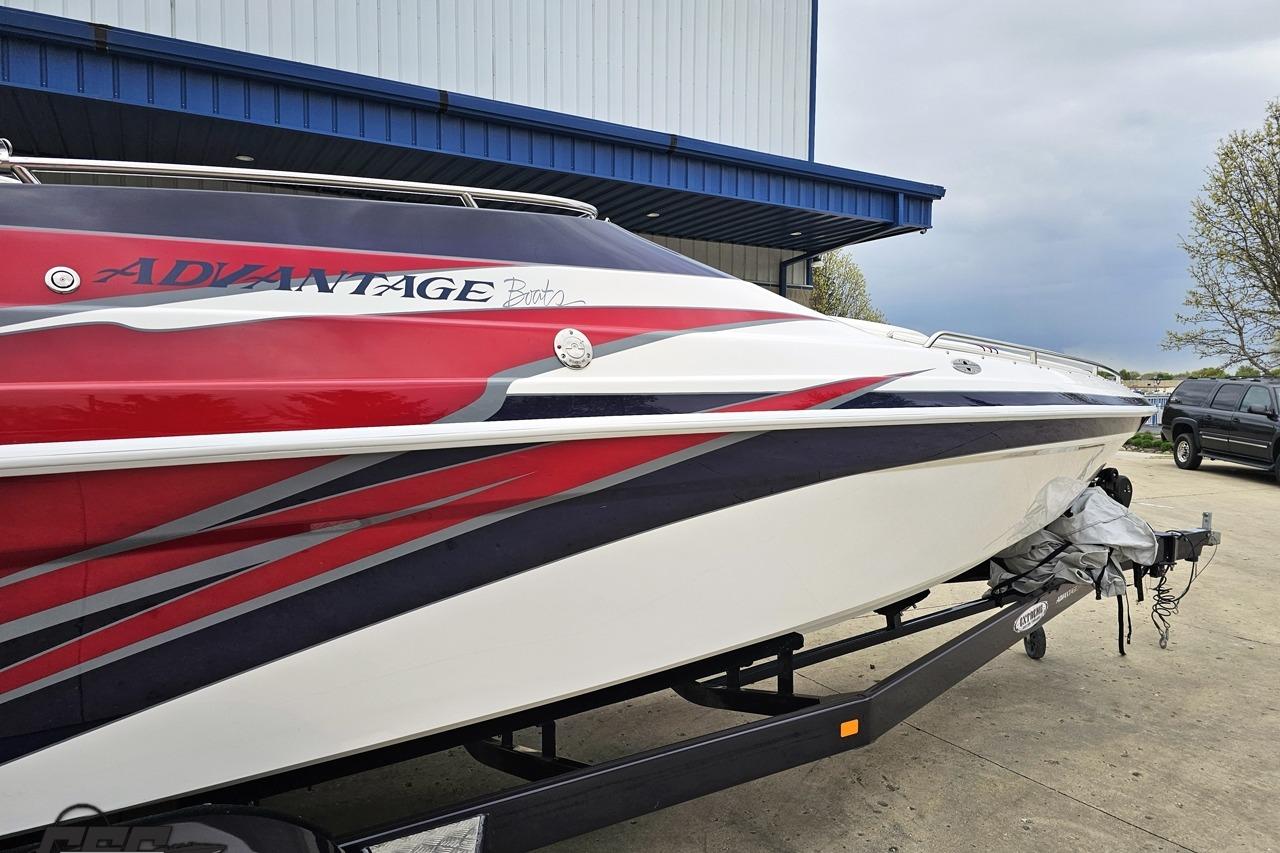 2019 Advantage 25 Citation Bowrider boat with red and white design on trailer.