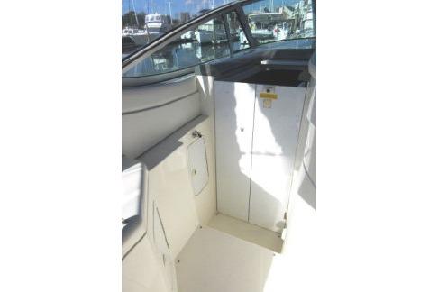 2005 Cruisers Yachts 370 Express interior with seating and storage area.