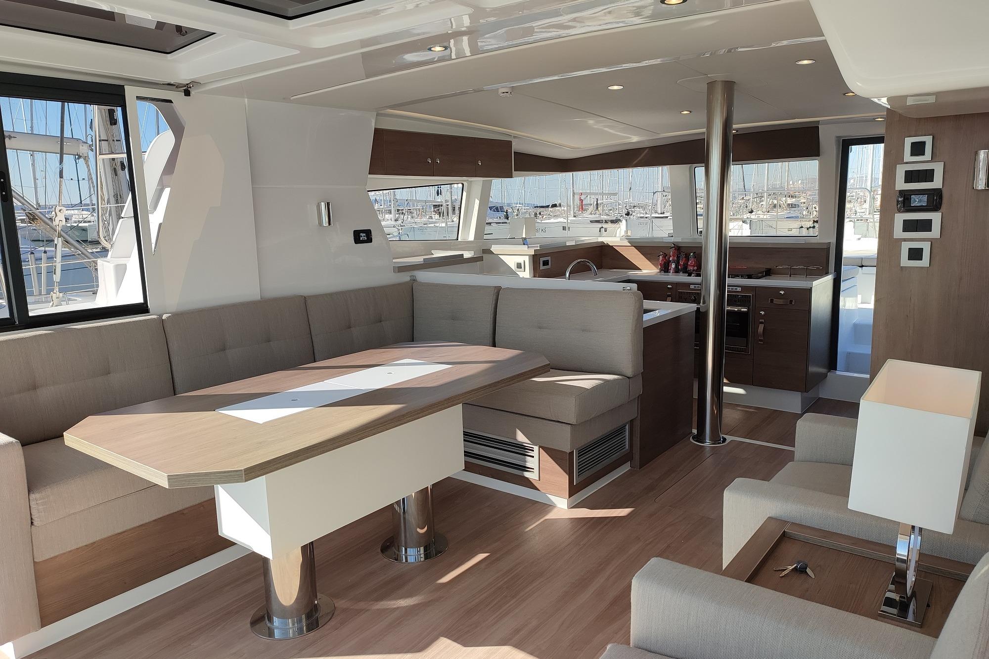 Luxurious interior of 2023 Bali 4.2 yacht with modern kitchen and seating area.