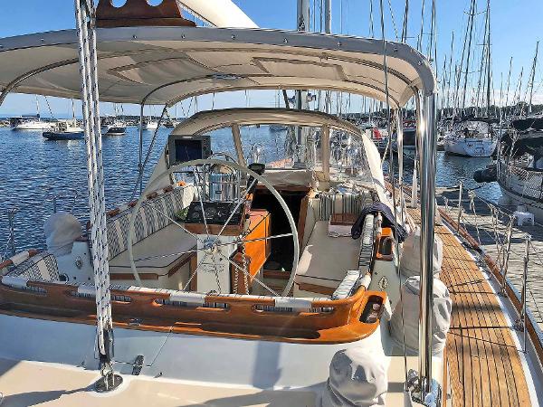 The image shows a 1988 Little Harbor 53 sailboat docked in a marina.