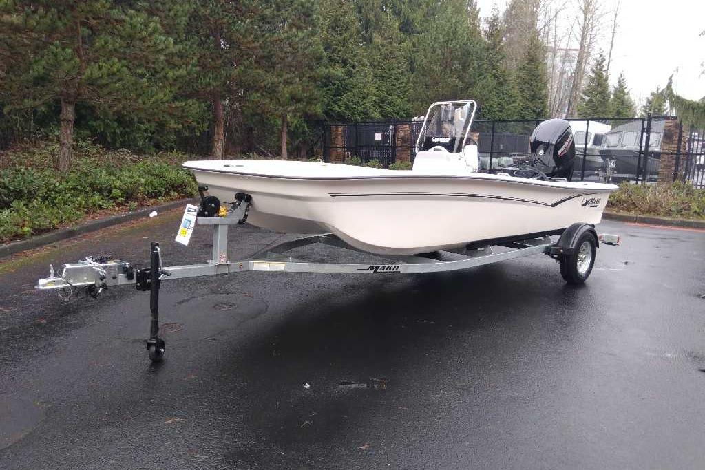 2026 Mako Pro Skiff 17 CC boat on trailer, parked outdoors.