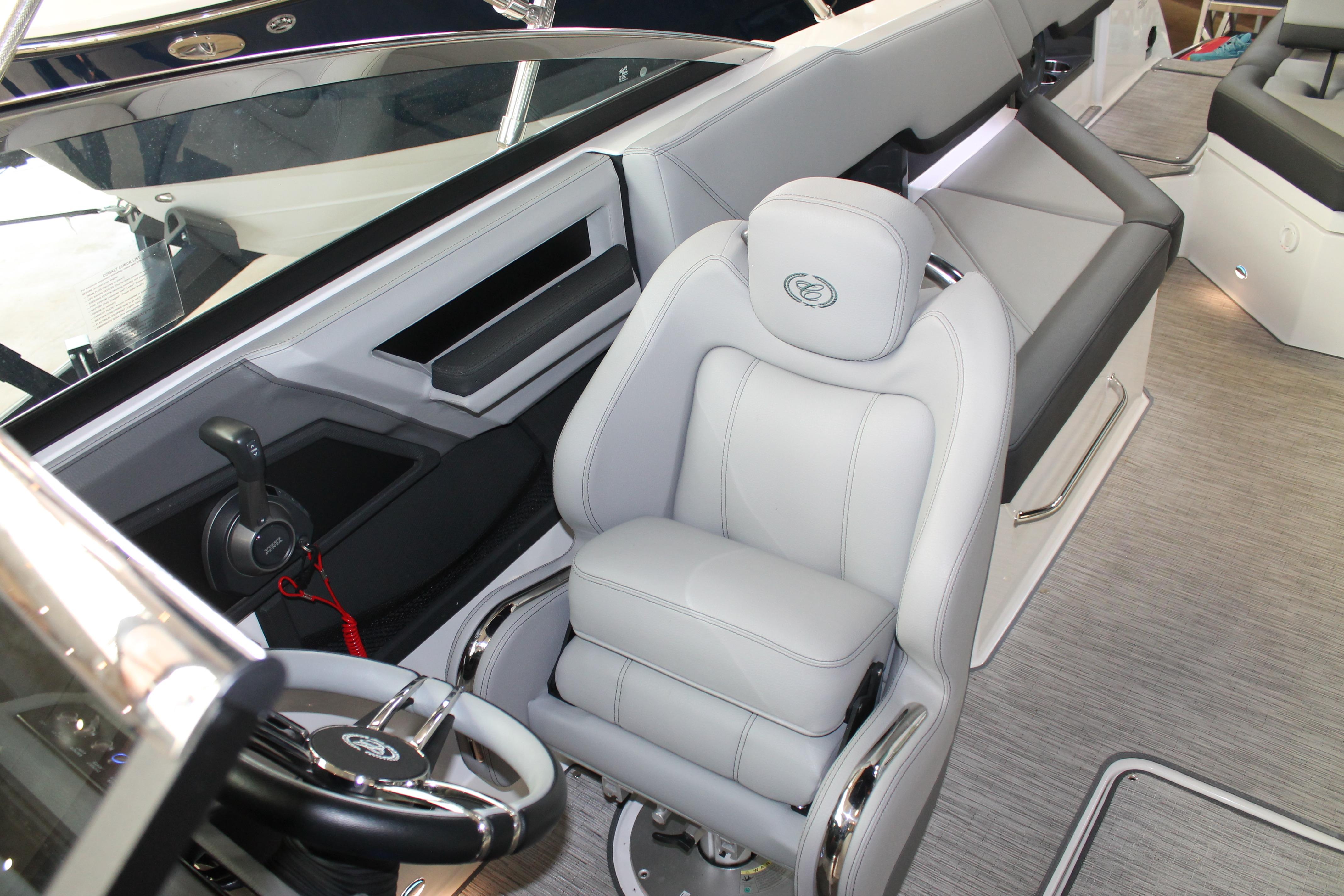 2023 Cobalt R8 boat interior with luxurious seating and modern steering controls.
