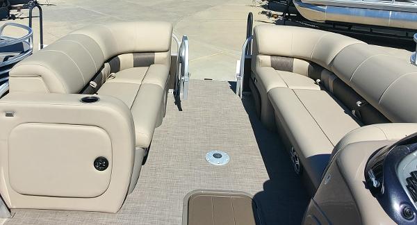 2023 Sun Tracker SportFish 22 XP3 pontoon boat interior with beige seating.