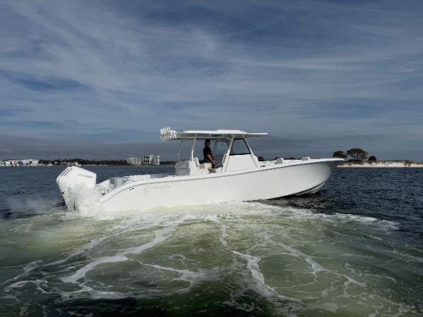 2025 Yellowfin 39 Offshore boat cruising on open water under a cloudy sky.