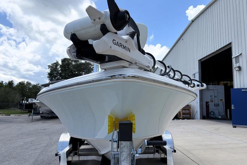 2025 Key West 210 Bay Reef boat with Garmin equipment, parked outside a warehouse.