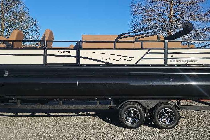 2026 Ranger 223FC pontoon boat on trailer, side view, clear sky background.