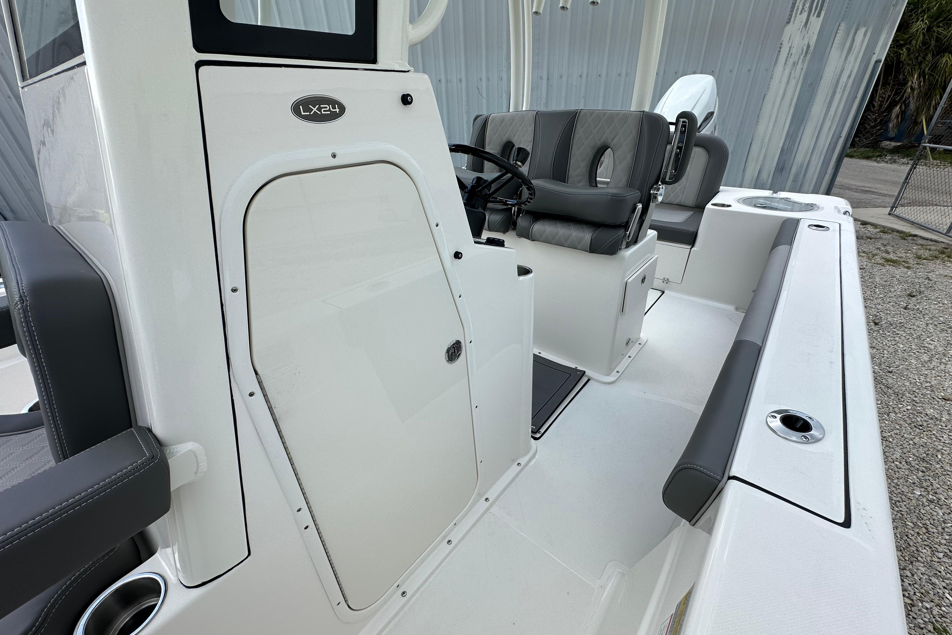2027 Sea Born LX24 Center Console boat interior with seating and steering wheel.