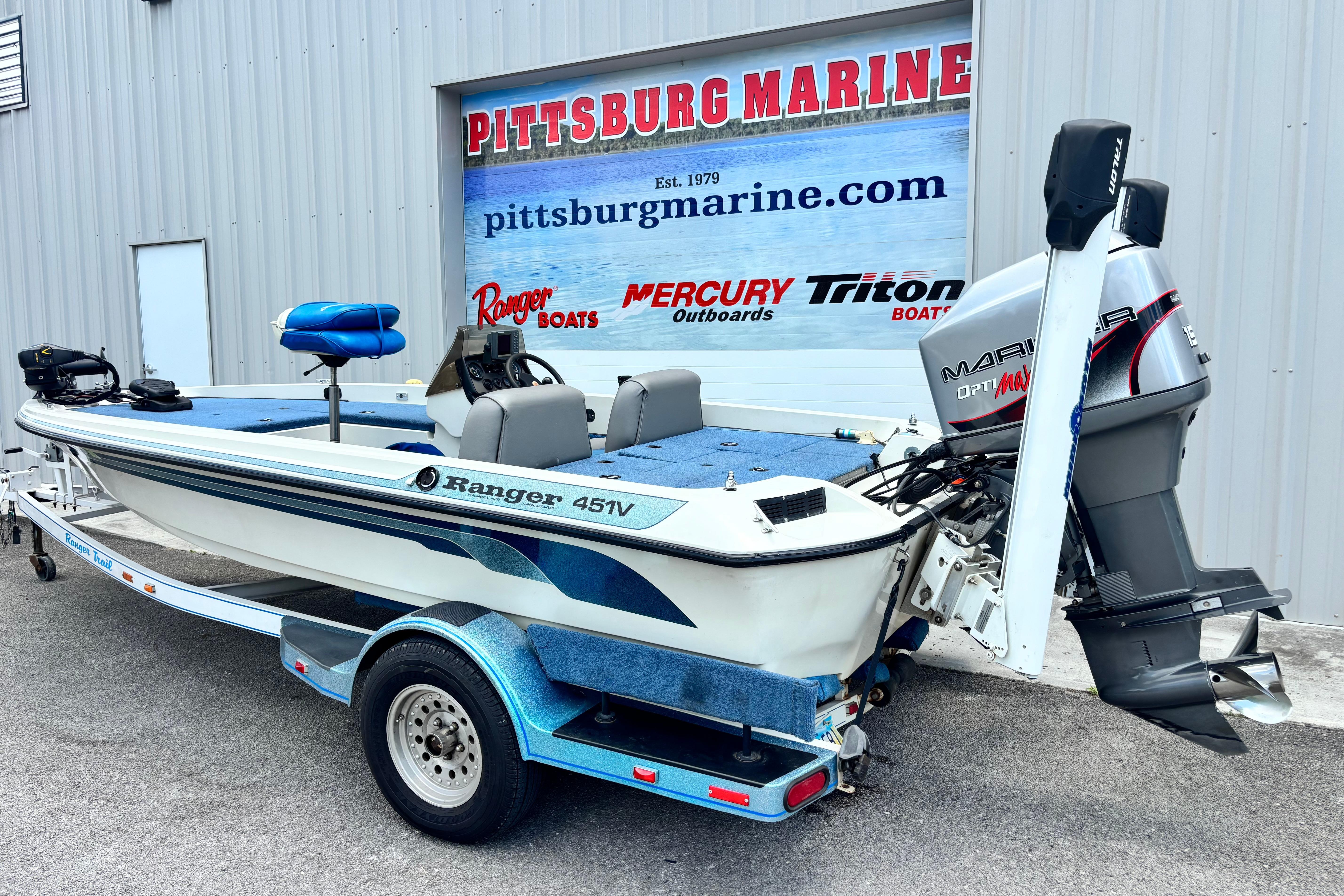 1991 Ranger 461VS boat with Mariner outboard motor at Pittsburg Marine dealership.