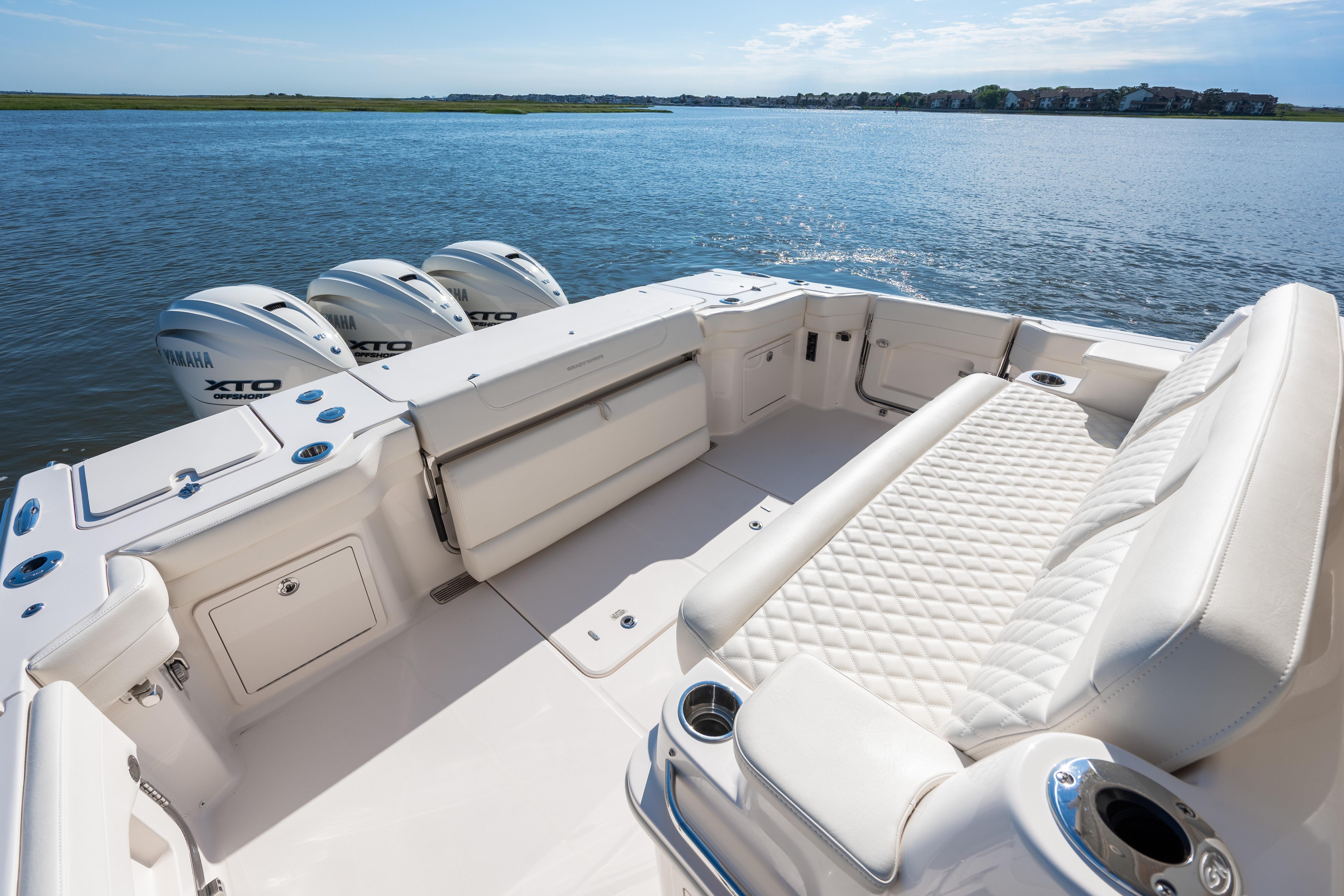 2025 Grady-White Canyon 386 boat with Yamaha engines on calm water.