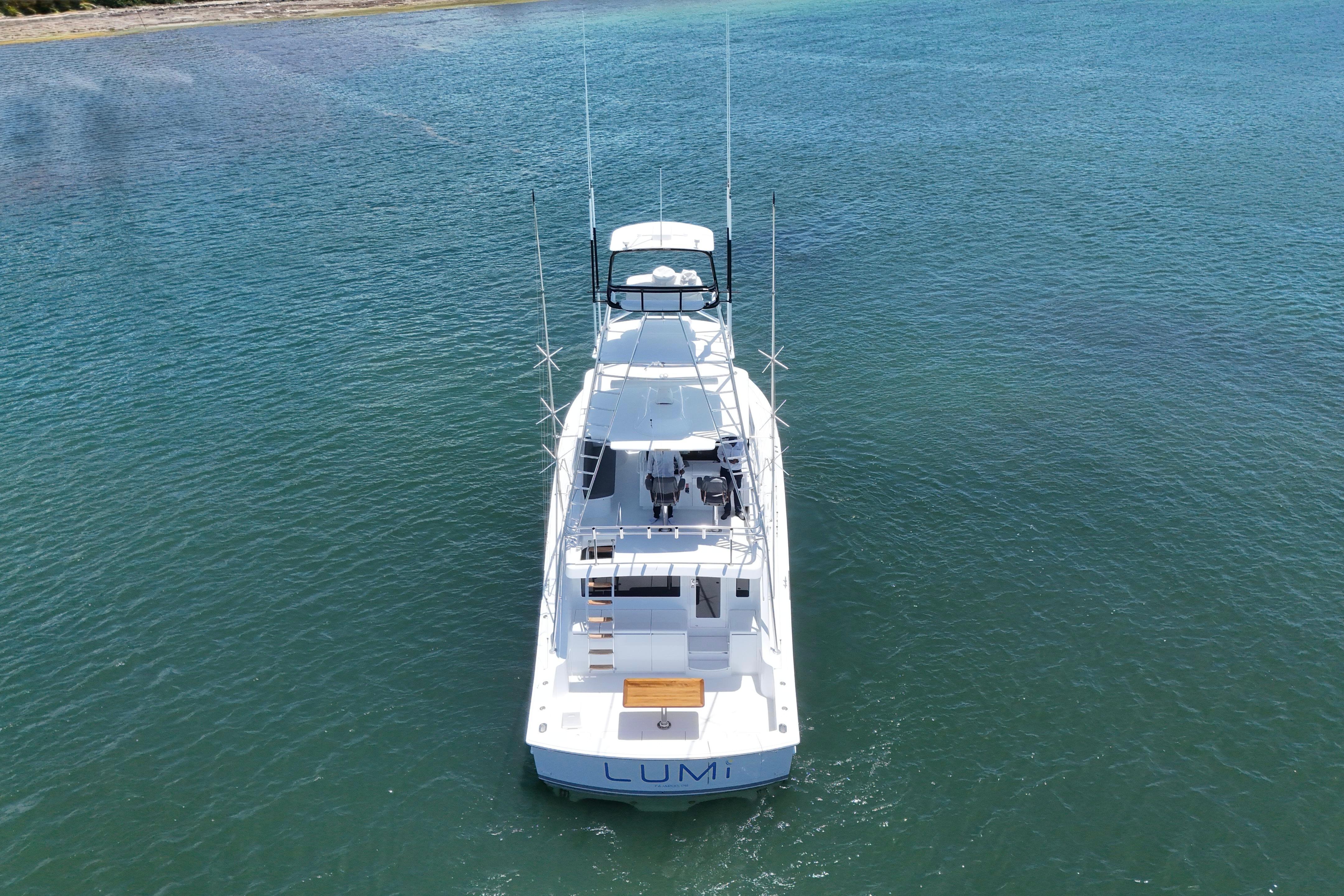 Aerial view of 2003 Hatteras 54 Convertible yacht on calm water.