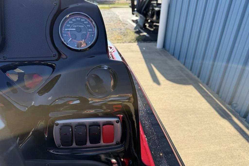 Close-up of a 2026 Nitro Z17 dashboard with speedometer and control switches.