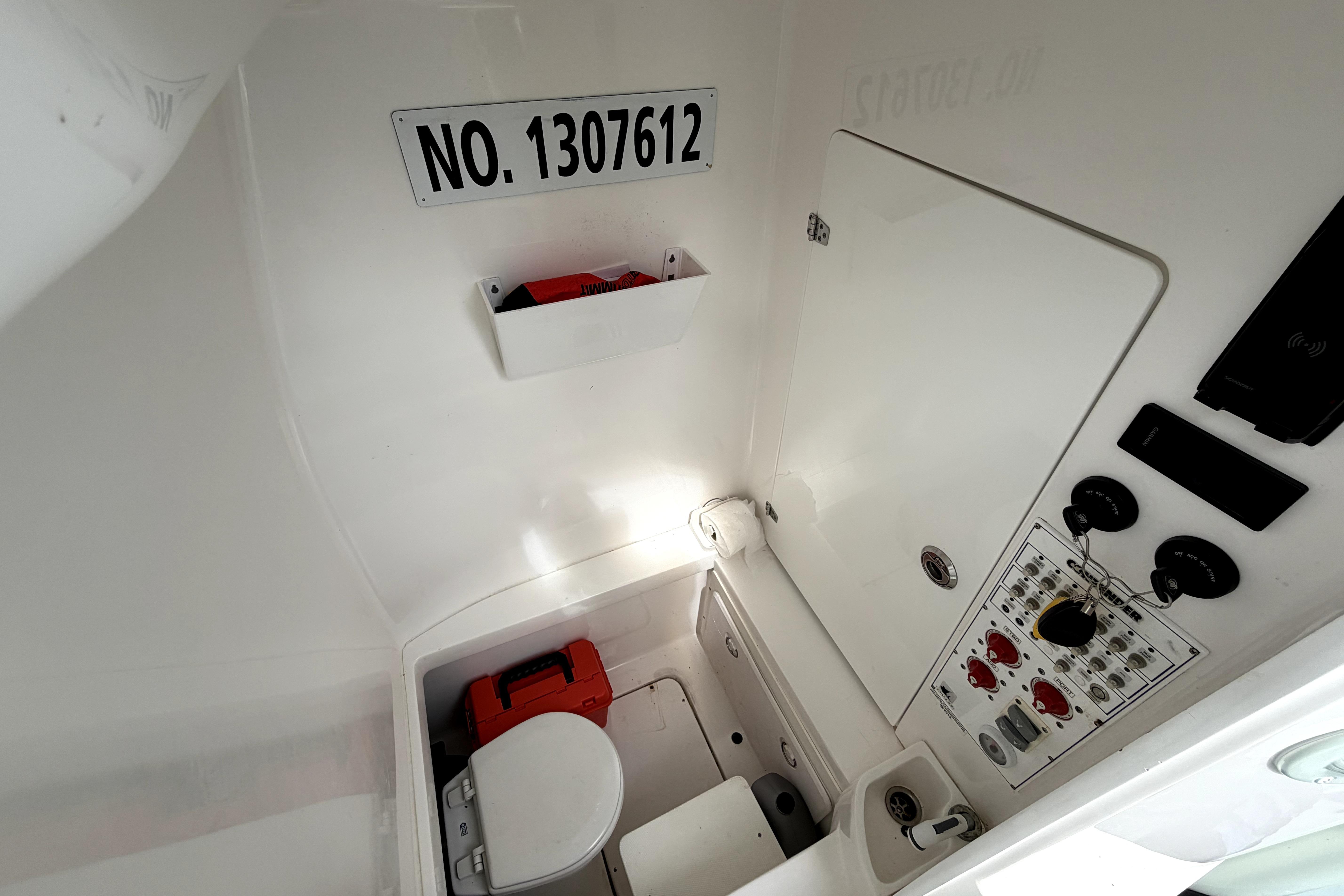 2019 Contender 30 ST boat interior with control panel and storage area.