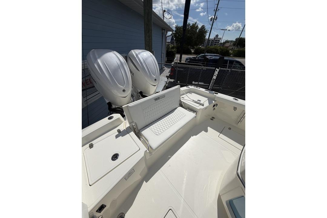 2026 Pathfinder 2800 Hybrid boat with dual outboard engines and spacious seating area.
