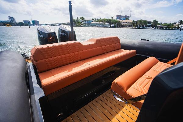 2024 Onda Magna boat with orange leather seats and twin Mercury outboard engines.