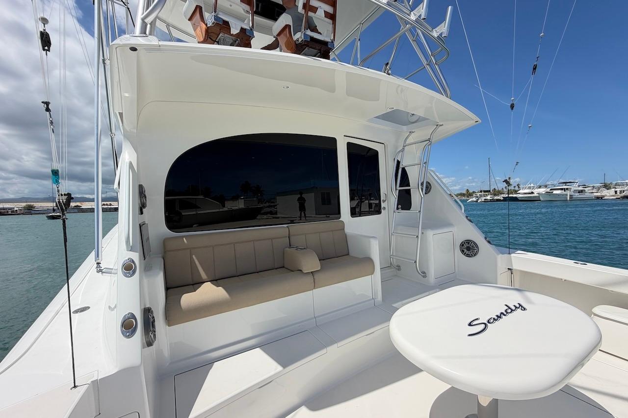 2012 Viking 50 Convertible yacht with seating area and ocean view.