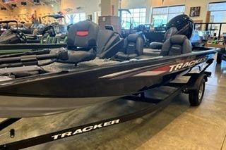 2026 Tracker Pro Team 175 boat displayed indoors on a trailer.