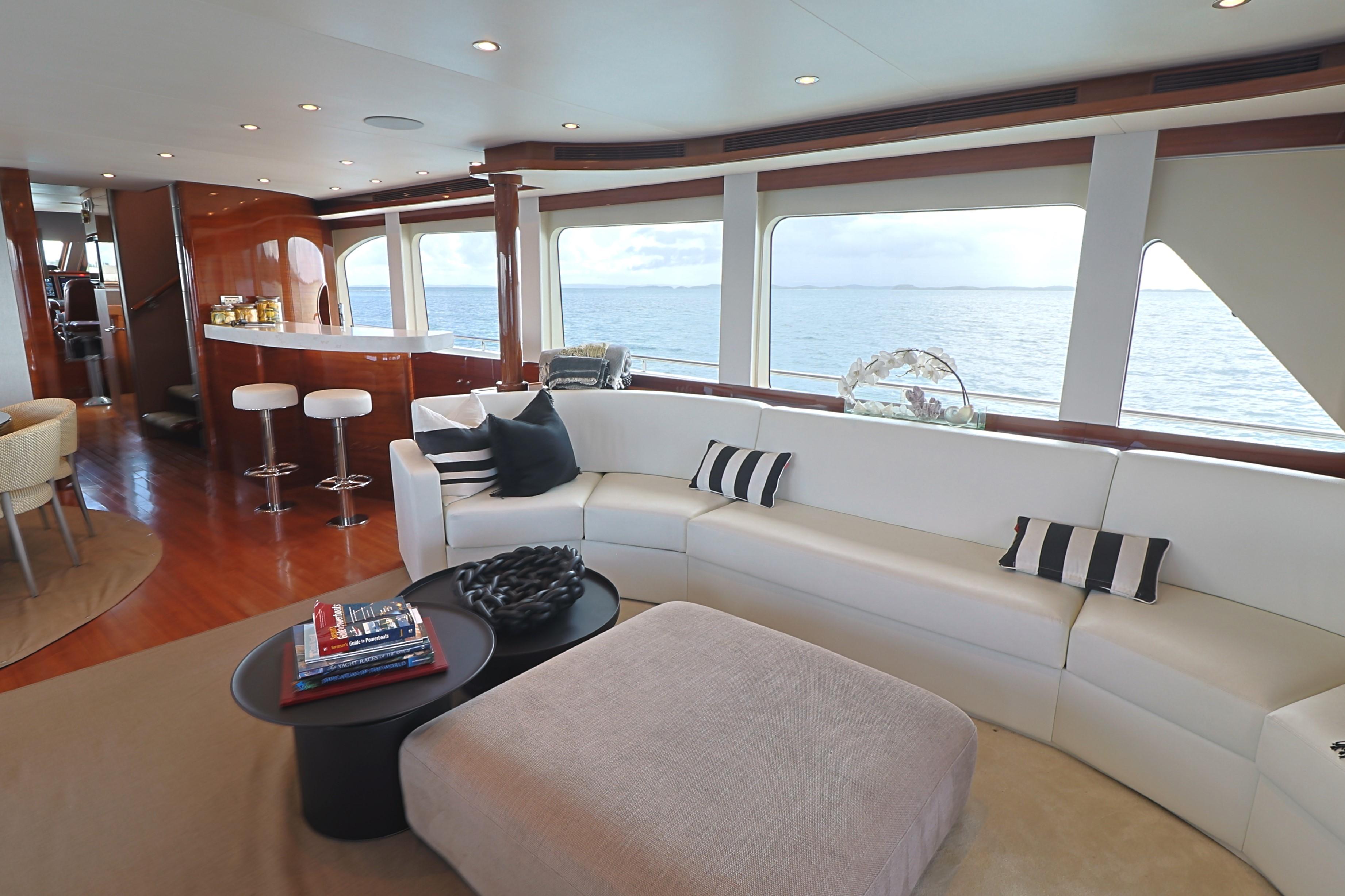 Luxurious interior of 2013 Cheoy Lee Bravo yacht with ocean view and modern furnishings.