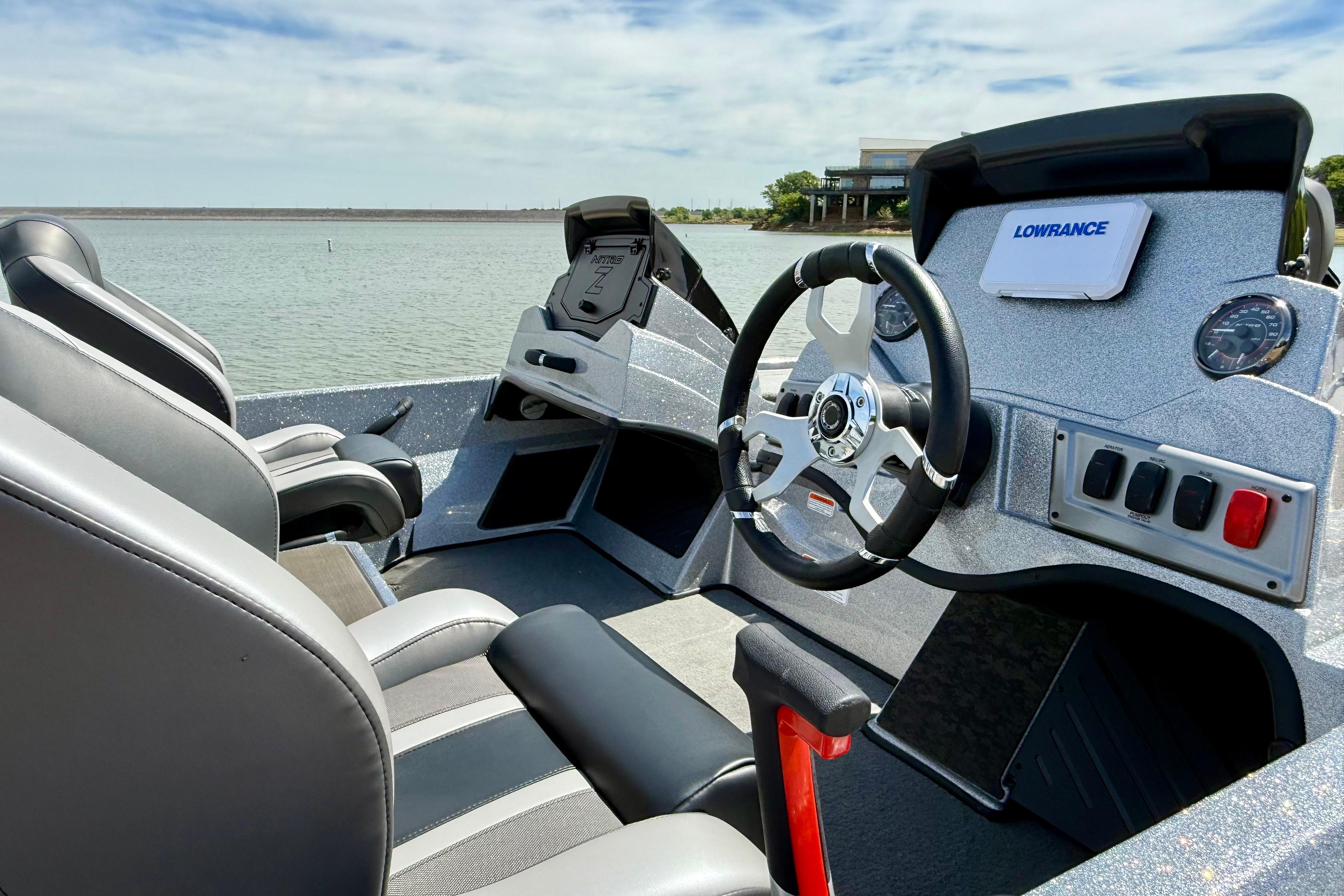 Interior view of 2026 Nitro Z19 XL boat with steering wheel and control panel.